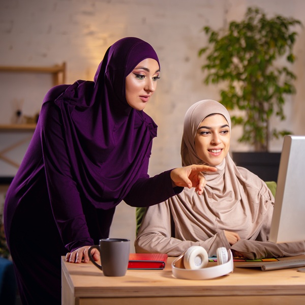 Happy muslim woman at home during online lesson. technologies, remote education, ethnicity concept Happy muslim woman at home during online lesson. technologies, remote education, ethnicity concept